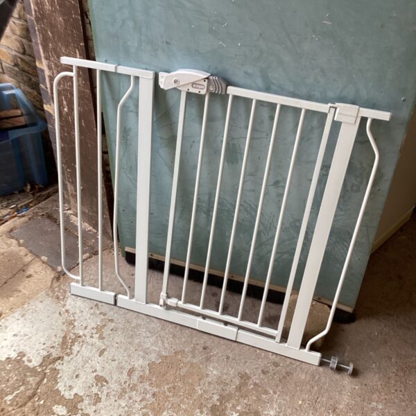 Regalo safety gate for babies and pets, showing signs of wear.