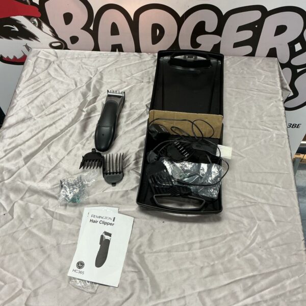 Remington hair clipper set with guide combs, power lead and black carry case