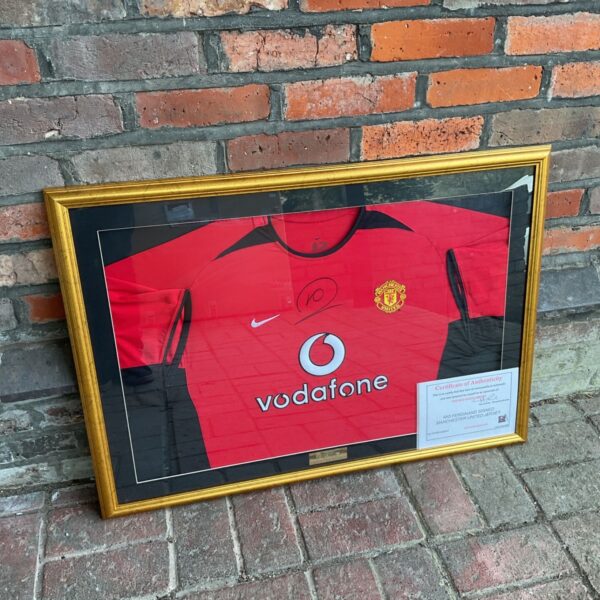 Framed Rio Ferdinand signed Manchester United red jersey in gold frame