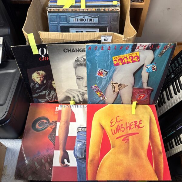 Collection of rock LP records including Bruce Springsteen and Queen.