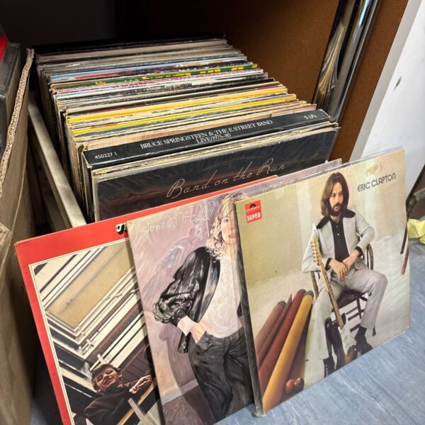 Collection of rock and pop 12 inch vinyl LP records with Springsteen and Clapton sleeves