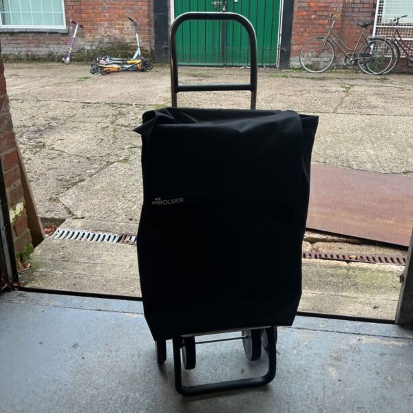 Black Rolser shopping trolley with fabric bag and two wheels