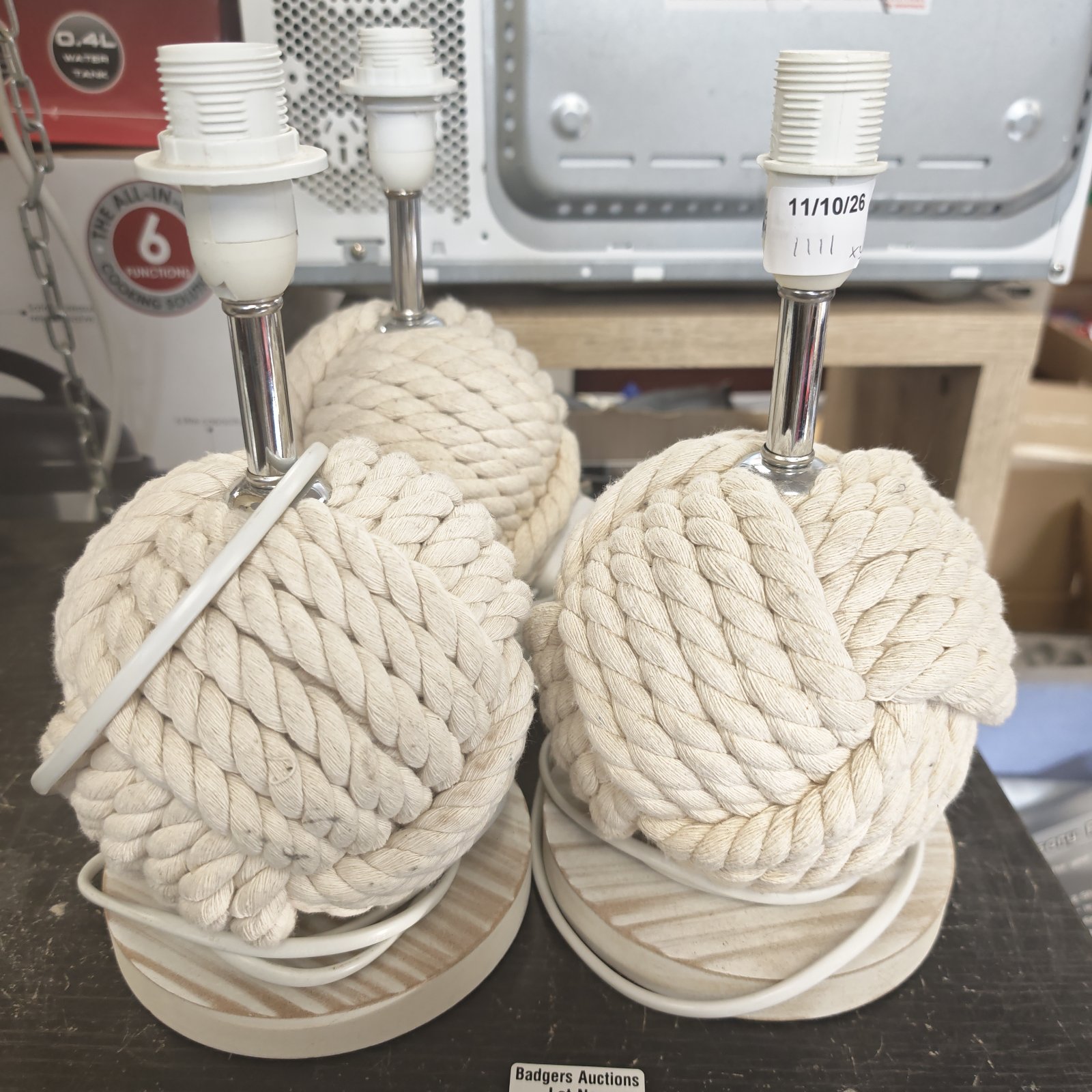 Three vintage rope table lamps with wooden bases.