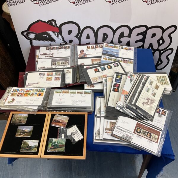 Large collection of Royal Mail first day stamp covers and locomotive plaques.