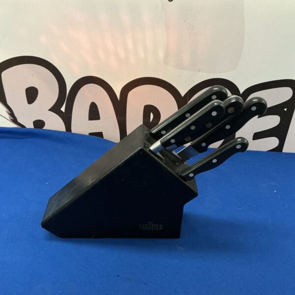 Sabatier chef knife set displayed for auction.
