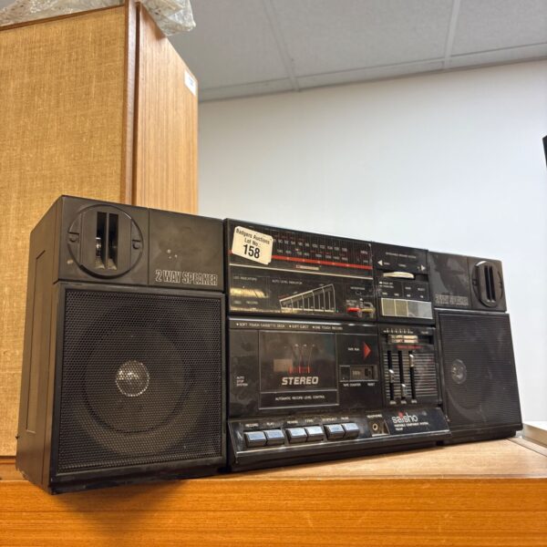 Vintage Saisho PM51P boombox with cassette player and radio.