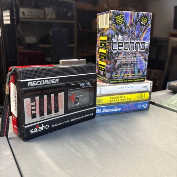 Vintage Saisho PS4 5EQ personal stereo cassette recorder with cassettes.