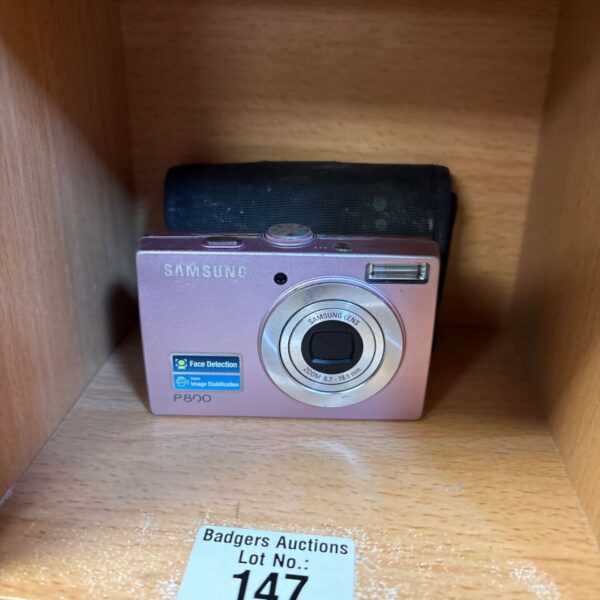 Silver Samsung P800 digital camera with case.