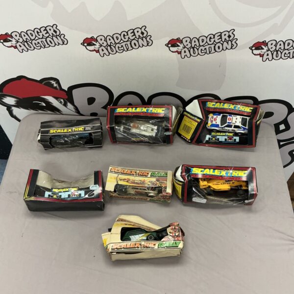 Lot of seven vintage Scalextric racing cars, including a rally car.