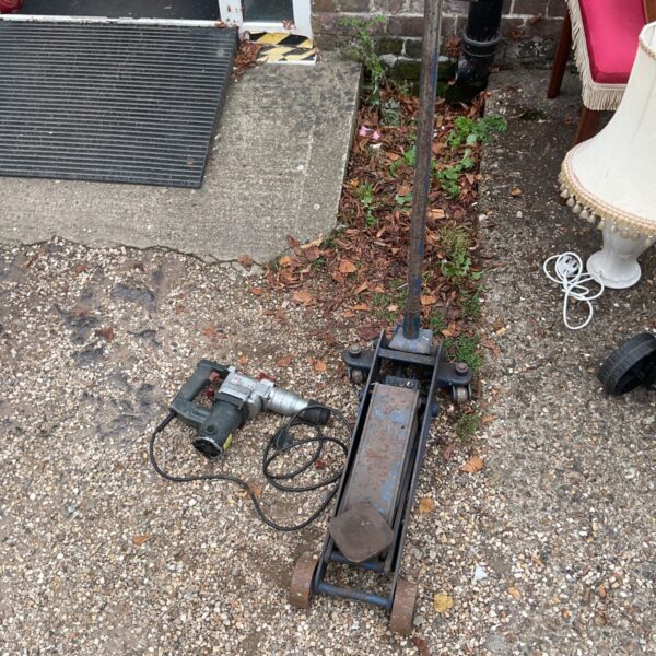 SDS hammer drill and car jack combination for DIY projects.