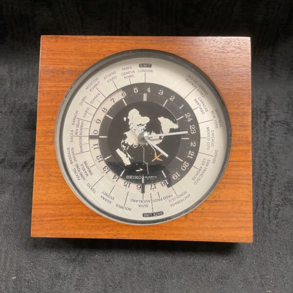 Vintage Seiko Quartz World electric clock showing multiple time zones.