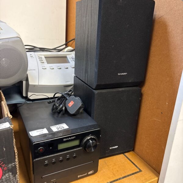 Black Sharp XL-B515D micro sound system with speakers.