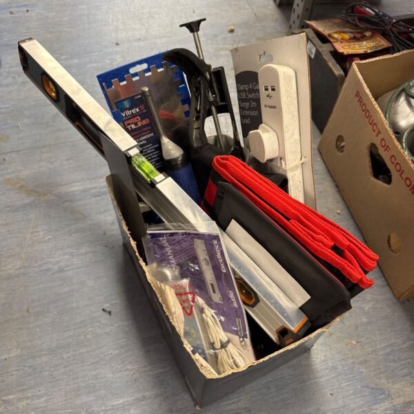 Shed clearance lot with tools including a spirit level and tile trowel.