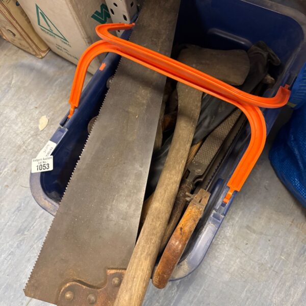 Shed tool clearance lot with saw, axe and files.