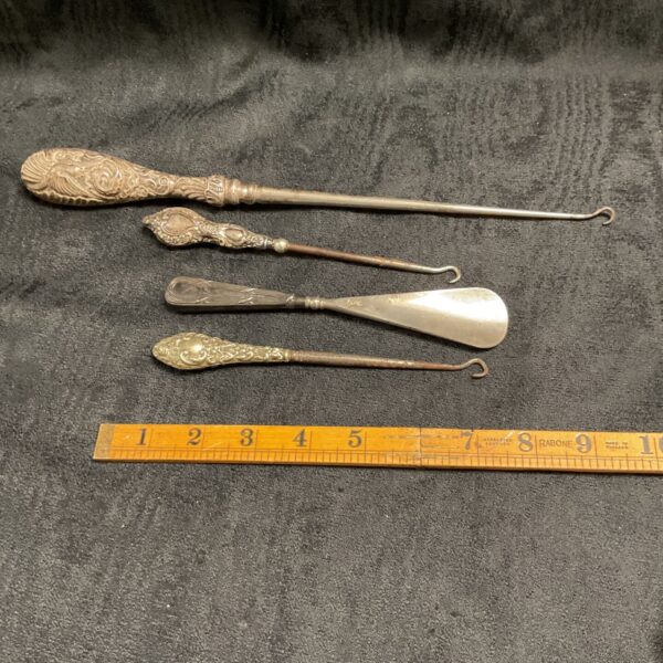Antique silver button hooks and shoe horn set, Victorian era grooming tools.
