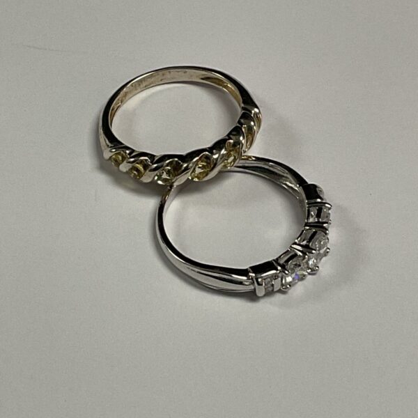 Silver ring set featuring citrine and white stones.