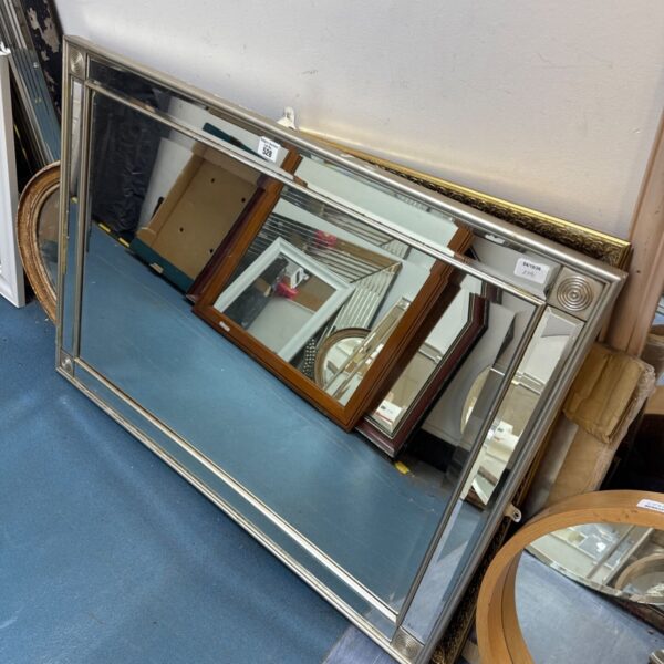 Large silver gilt overmantle mirror with bevelled glass.