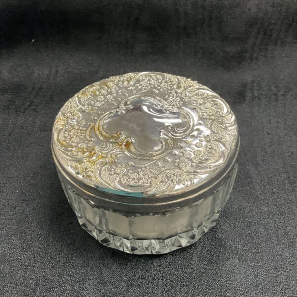 Vintage silver plate powder pot with floral embossed lid.