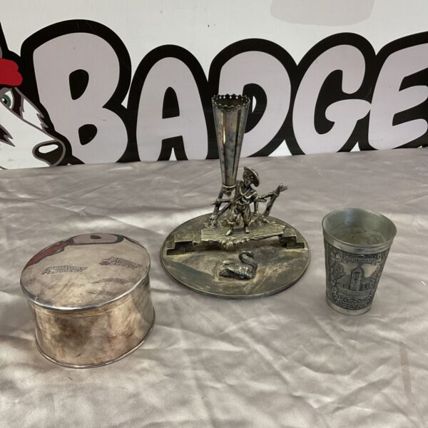 Traditional silver plate toothpick holder with shepherd figure beside pewter cup and lidded pot