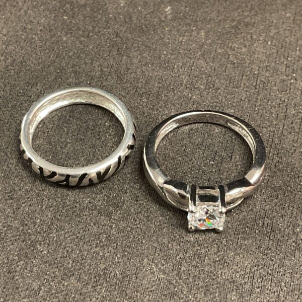 Silver ring with a textured band design.