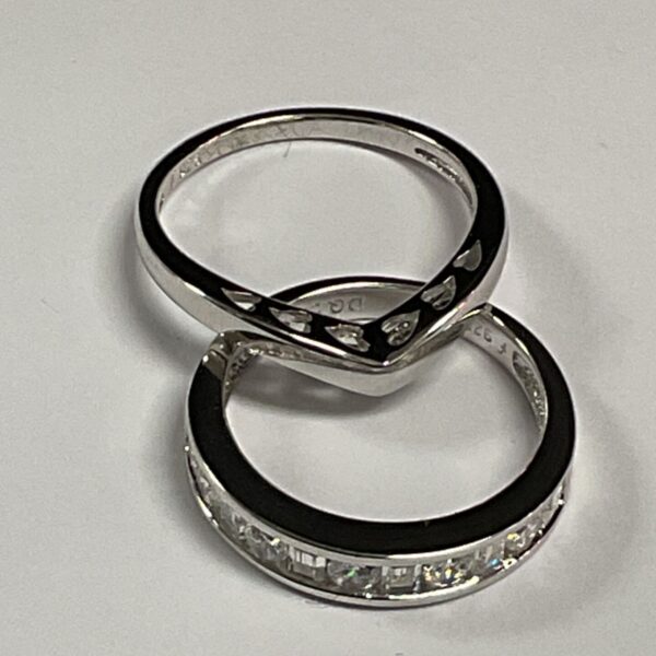 Silver stone set rings, sizes M and N, sparkling white stones.