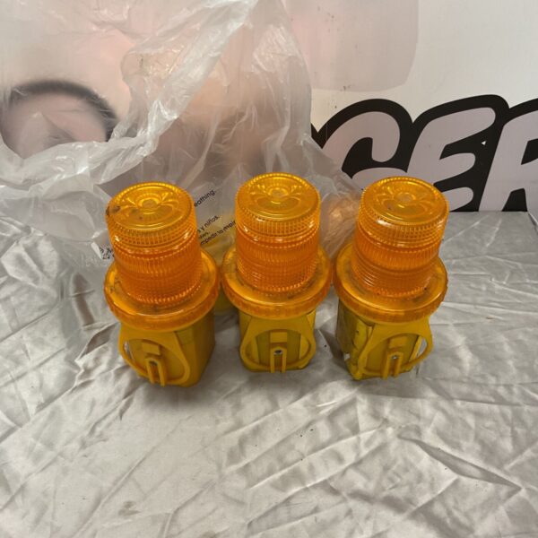 Three amber Silverline flashing warning lights with yellow bases