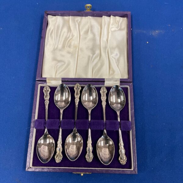Vintage silverplate tea spoons in a presentation case.