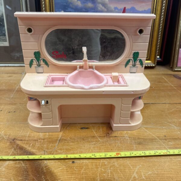 Vintage Sindy dolls house vanity unit with mirror and sink.