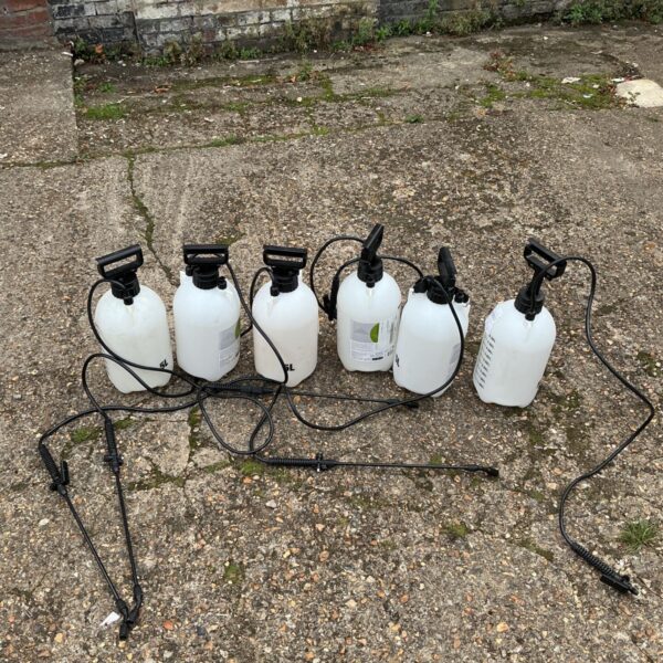 Six 5L hand pump sprayers for garden and cleaning use.