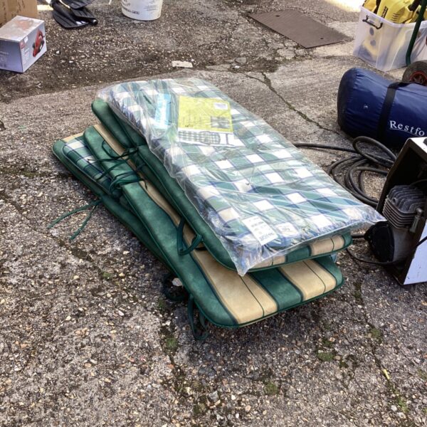 Six striped sun lounger cushions for garden use.