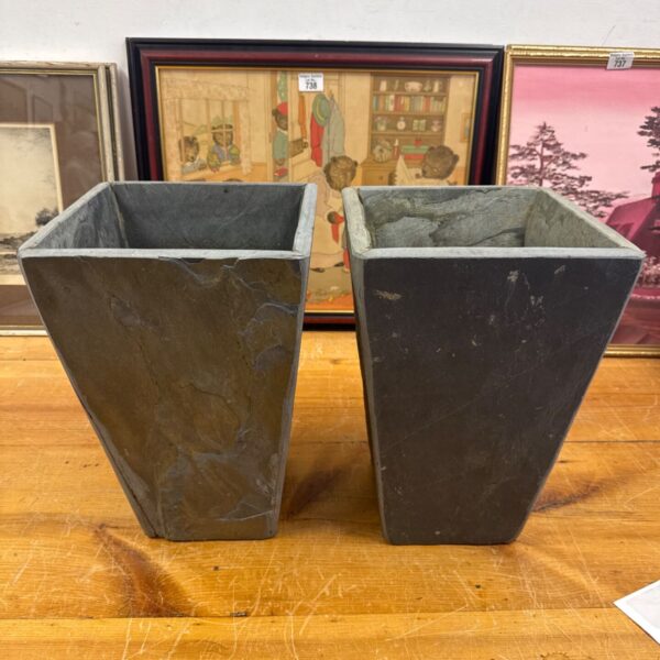 Pair of weathered slate garden planters for outdoor use.