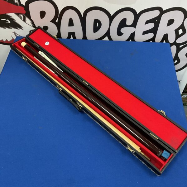 Snooker cue with dark shaft and blue chalk in lined carry case