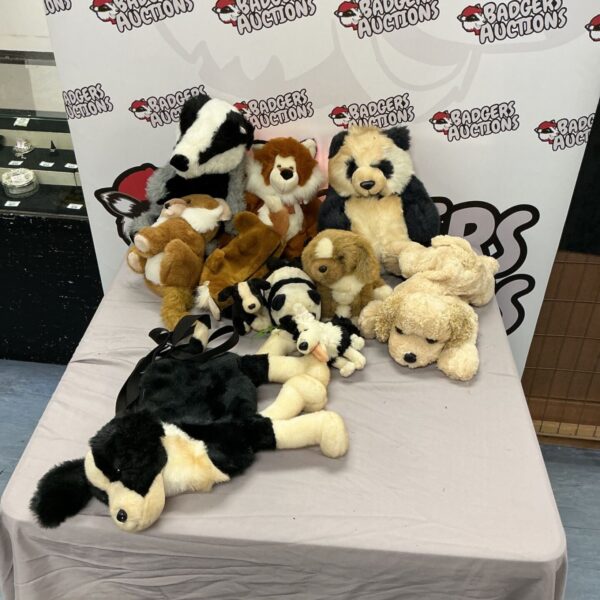 A large lot of vintage and modern soft toys and stuffed animals.