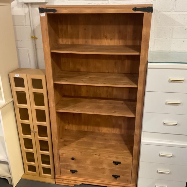 Solid pine two drawer bookcase with open shelving and black metal handles
