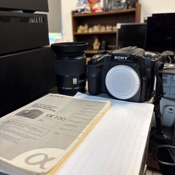 Sony DSLR-A100 digital SLR camera with lens, lens hood and user guide