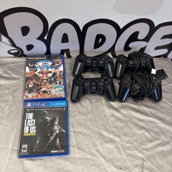Sony PlayStation controllers and Gitaroo Man and The Last of Us game cases