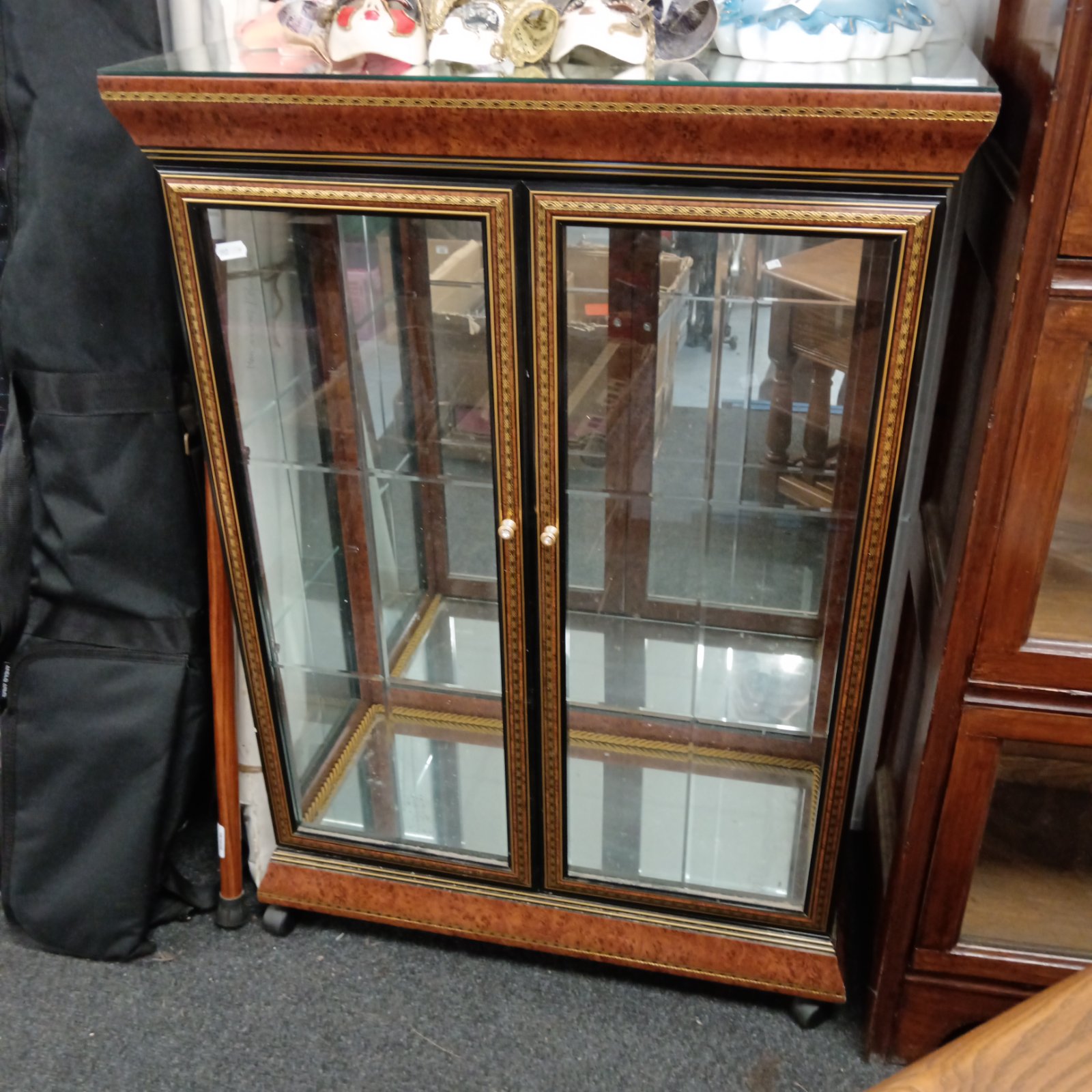 Antique Sorrento Italian display cabinet with mirrored backing.
