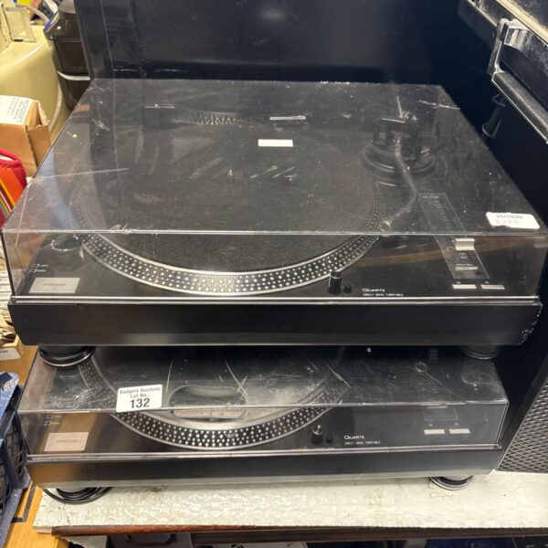 Two black Soundlab Quartz direct drive turntables stacked with clear dust covers