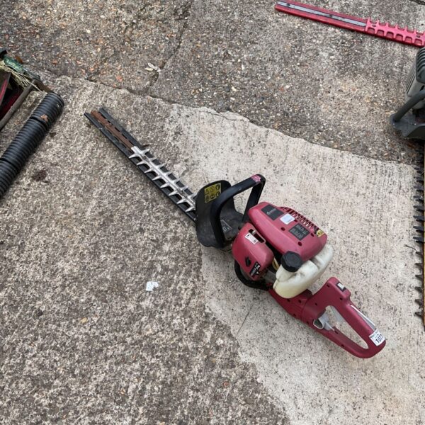 Used Sovereign petrol hedge cutter for garden landscaping.