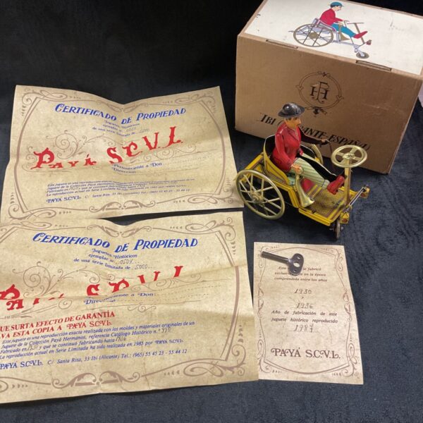 Vintage Spanish tinplate clockwork car with original box and papers.