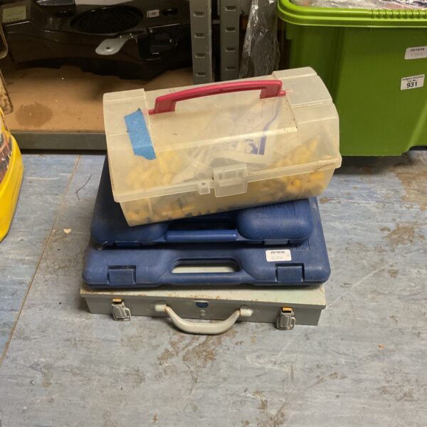 Stack of toolboxes including clear plastic organiser, blue hard case and grey metal case