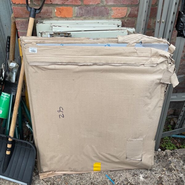 Four stainless steel splashbacks stacked together, ready for kitchen use.