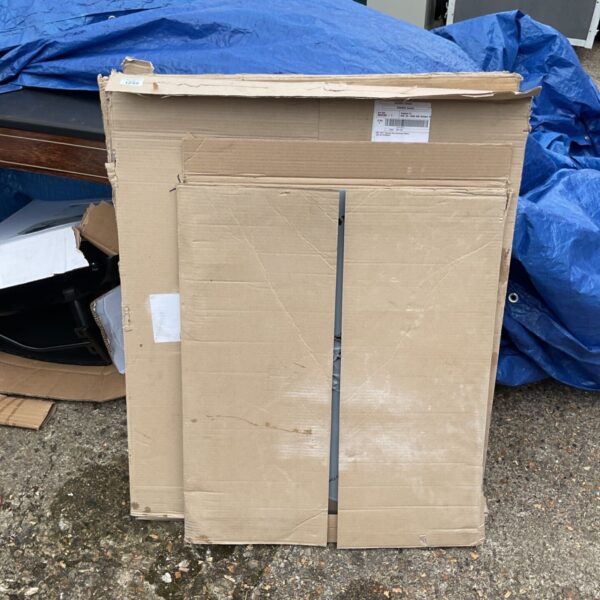 Stainless steel splashbacks in cardboard packaging, ready for kitchen installation.