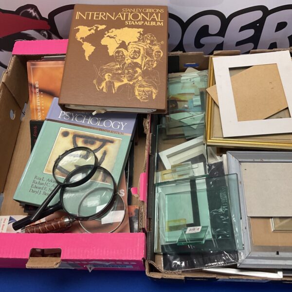 Mixed lot of vintage stamp album, psychology books, and photo frames.