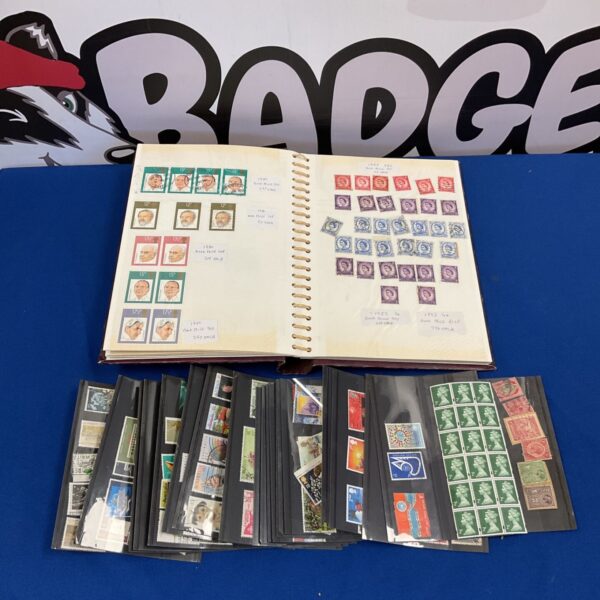 Vintage stamp albums with British stamps visible.