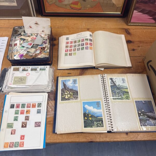 Large collection of vintage stamps and postcards for collectors.
