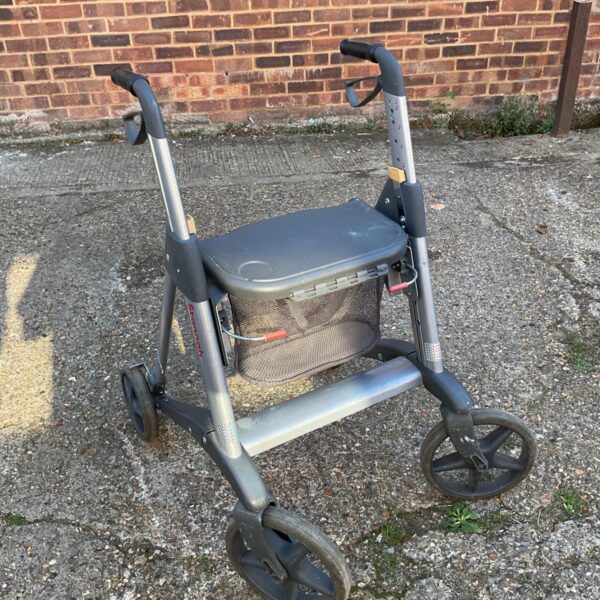 Stannah active mobility walker with a seat and wire basket.