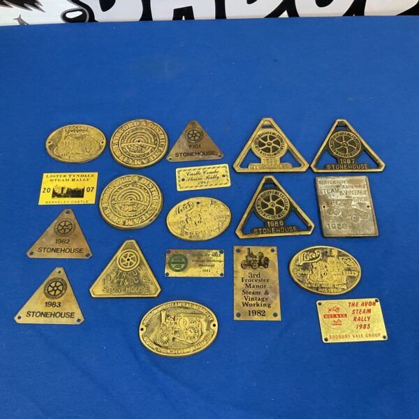 Collection of vintage brass steam rally plaques.