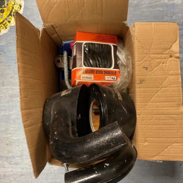 Automotive steering rack gaiter kit and air filter assembly in a box.