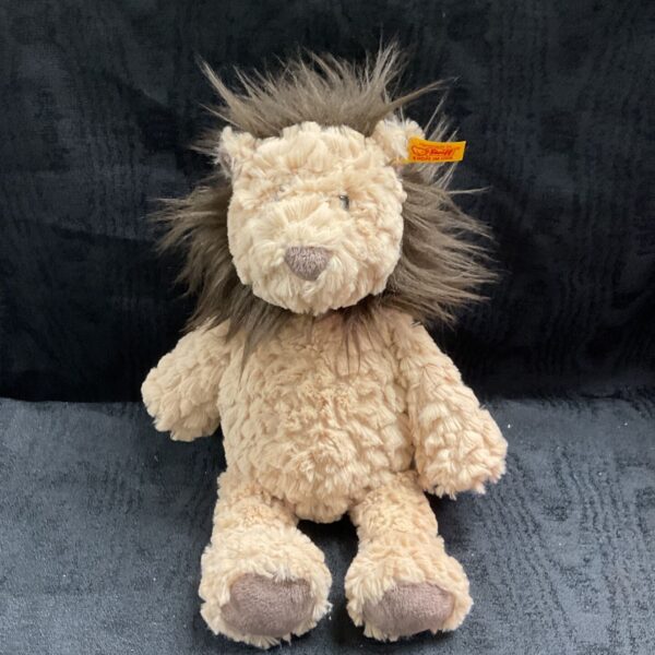 Cream plush Steiff lion teddy soft toy with brown mane, seated